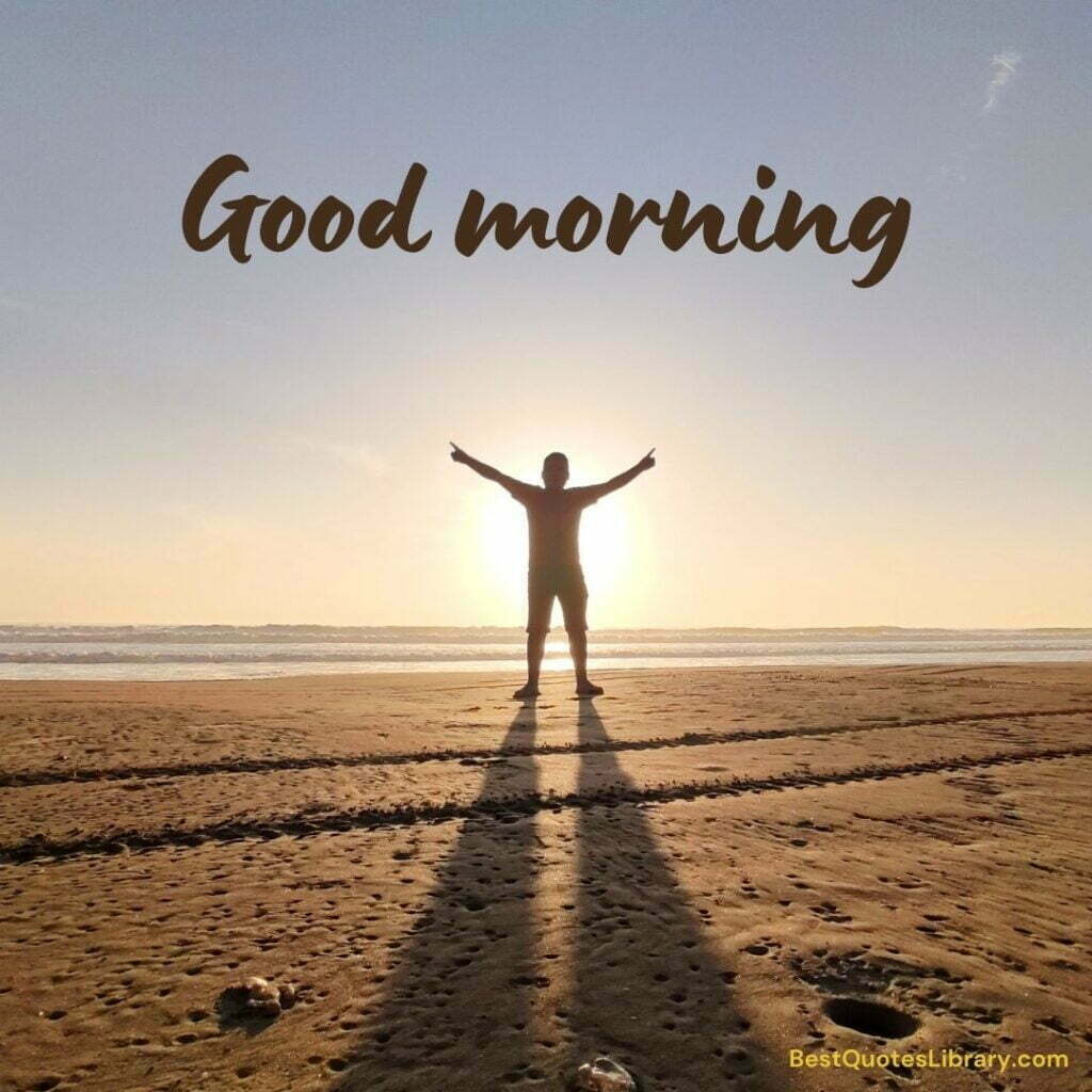 A man standing with sun on beach in morning