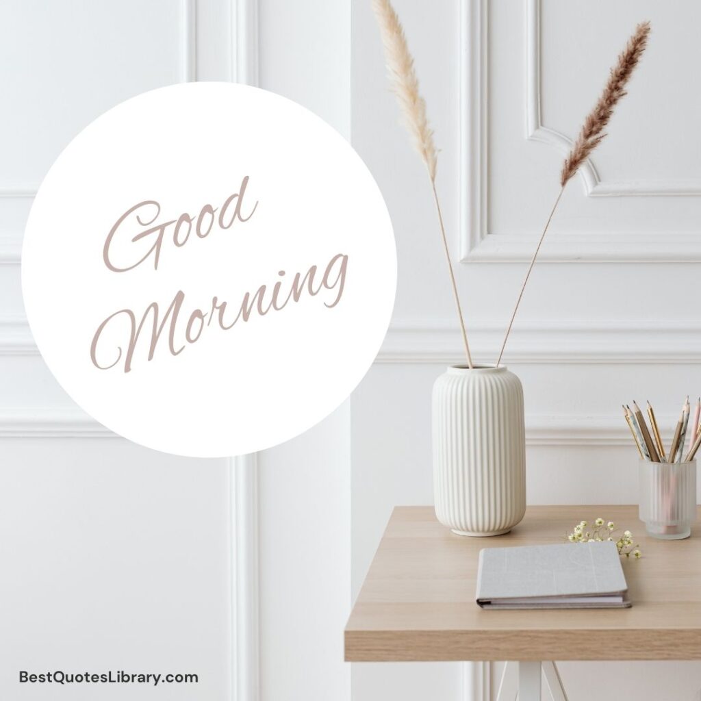 a flowerpot with two feathers keeping on desk with notebook and pencils