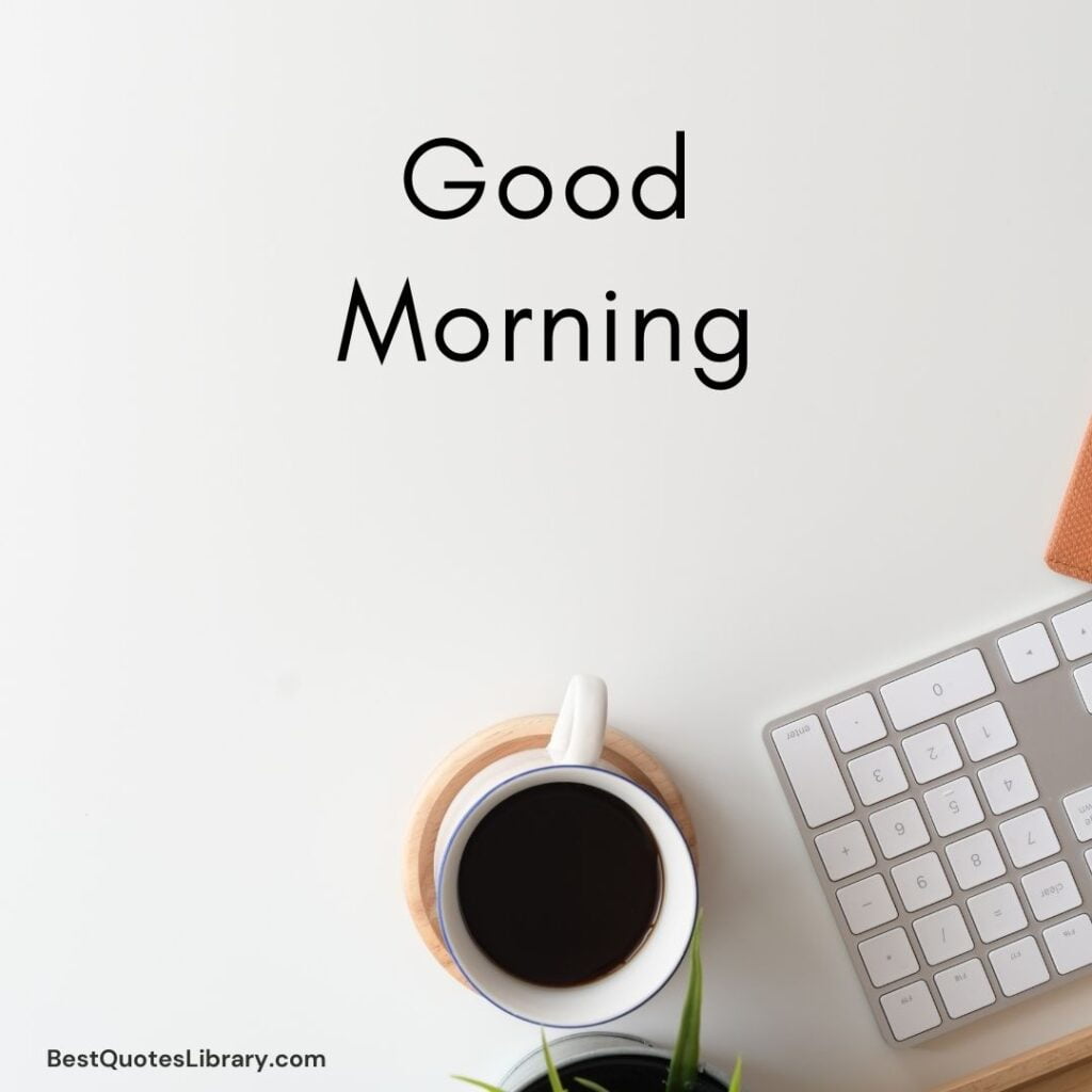 a keyboard and tea with cup on desk in the morning