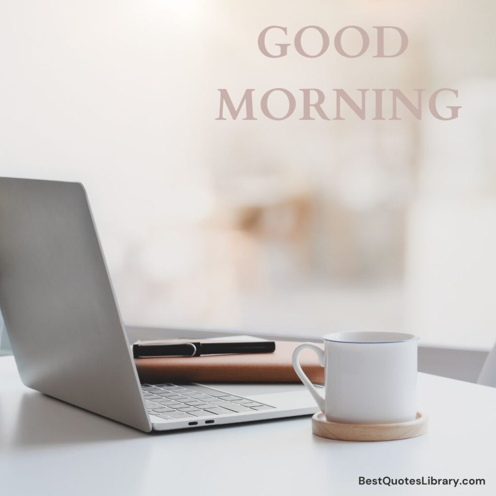 a laptop & the cup with the tea and diary with pen on the desk in morning