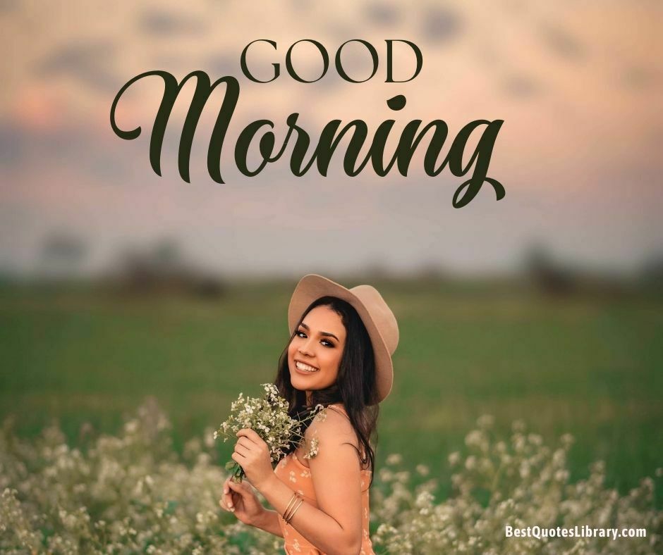 a beautiful girl wearing round cap smile holding with some flower wishing good morning in garden