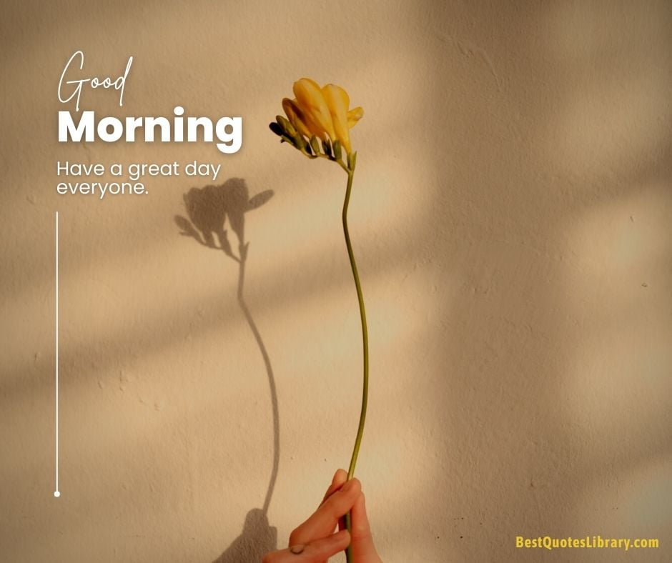 download free images flowers CANARY YELLOW flower holding in hand with light background wishing good morning quote on bestquoteslibrary